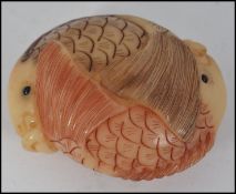 An unusual Chinese carving / netsuke type in the form of two intertwined carp fish