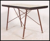 A retro mid century atomid / sputnik tiled topped coffee table of smaller proportions raised on