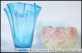 A 20th century ceramic planter in the art nouveau style together with a large blue glass