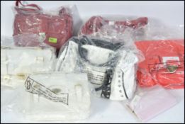 A collection of ladies leather handbags to include white and red examples,