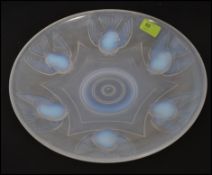 An 1930`s French Ezan opalescent glass dish in the manner of Lalique moulded with birds,