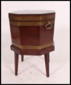 A 19th century George 3rd mahogany octagonal brass bound wine cooler - celarette.
