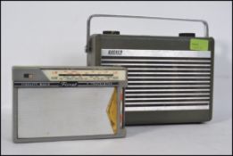 A vintage Hacker Democrat portable radio together with a Floret Fidelity transistor radio