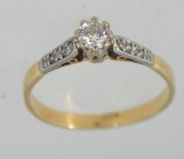 A tested 18ct gold solitaire diamond ring marked 18ct.