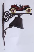 A cast iron exterior hanging door bell on a bracket, the top decorated with a car Hand painted,