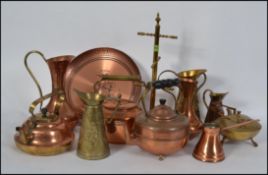 Mixed lot of 20th century copper and brass goods to include 3 kettles and jugs etc
