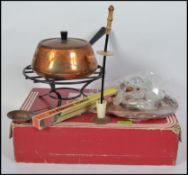 A retro 1970's cased spring of Switzerland Gourmet Line Fondue set, consisting of pan, burner,