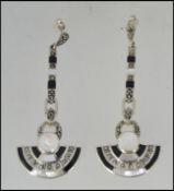A pair of silver and onyx marcasite art deco style drop earrings, each of half roundel form.