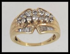 A tested 14ct gold diamond ring having approx 80pts of diamonds,