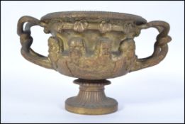 A 19th century Continental gilded bronze twin handled neo - classical centrepiece bowl / tazza,.