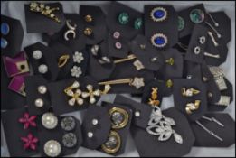 A collection of 30+ costume / dress jewellery earrings of various forms and styles (please see