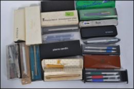 A collection of cased 20th century fountain pens and ballpoint pens to include examples by Parker,