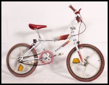 A retro 1980's Peugeot BMX stunt bike, modelled on a Raleigh Burner,