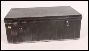 A 20th century tin storage trunk chest of large form with hinged top.
