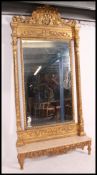 A very large 20th cenutry full length mirror having a giltwood frame of rococo design with large