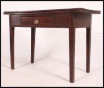 A 19th century country oak tea / games table.