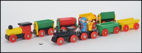 A collection of Brio train track ( wooden ) together with train and rolling stock