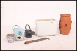 A vintage mid 20th century Belfast sink of small proportions along with some other garden items