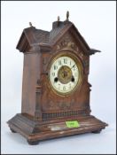 A late Victorian HAC - Hamburg America Company oak cased gingerbread clock having decorative face