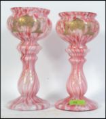 A pair of late 19th early 20th century glass mottled baluster vases,