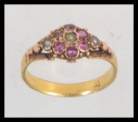 A Victorian tested 18ct gold pearl and amethyst set ladies ring set on decorative shank. Mark worn.