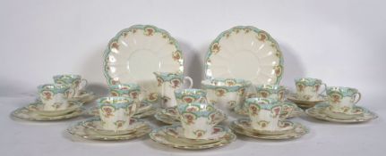 A good quality Edwardian bone china Tuscan tea service for ten, consisting of trio's, sugar bowl,