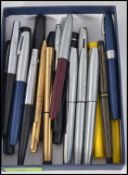 A collection of vintage Shaeffer fountain pens and ballpoint pens dating to the 20th century