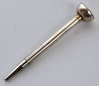 A silver propelling pencil in the form of a golf tee. Marked Sterling silver being fully working.