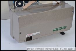 A vintage Magnon 880 automatic 8mm movie projector complete in the box