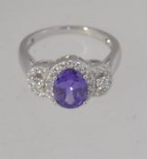 A contemporary ladies silver amethyst cocktail dress ring.