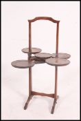 An early 20th century ` Monoplane ` five plate mahogany modular cake-stand raised on squared