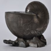 A silver plated 19th century Victorian nautilus shell form spoon warmer being finely engraved with