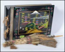 A musical Japanese mid century postcard / photo album, along with a 19th century silk parasol.