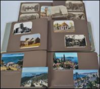 POSTCARDS: A collection of three assorted albums of postcards and photographs - mostly mid-century