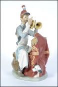 A Lladro figure ' Practice makes Perfect ' Limited edition of 1306 / 5000 Norman Rockwell Special