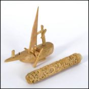 A carved 19th century bone decorative boat with moving parts,