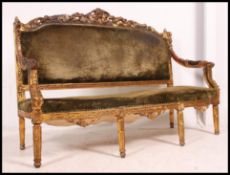 A 19th century French gilded canape sofa settee.