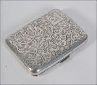 A pretty chase decorated silver hallmarked cigarette case,