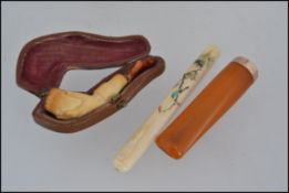 A 9ct gold cigar cheroot hallmarked for Birmingham 1914 by AF&Co together with a small cased