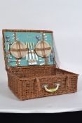 A Sirram vintage mid century picnic hamper complete with some contents in a good original whicker