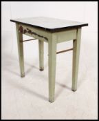 A vintage mid century enamel metal top and painted pine side table having end drawer with green