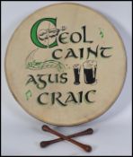 A cased Tipperary Celtic Irish Bodhran ( hand held drum ) with two wooden beaters and Gaelic motif