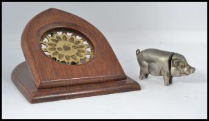 An early 20th century white metal vesta in the form of a pig with hinged head.