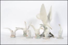 A collection of Lladro figurines,