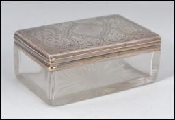 A Victorian silver hallmarked lidded glass pin dish, having a London assay mark,