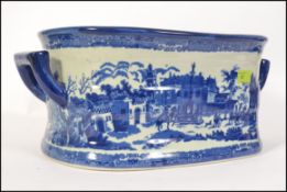 A large Staffordshire blue and white foot wash bowl.