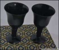 A stunning pair of Chinese black jade miniature goblets.
