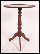 A 19th century Georgian mahogany tripod wine table.