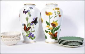 A pair of Franklin Mint vases by John Wilkinson entitled ' The Alpinee Butterfly Vase ' and the '