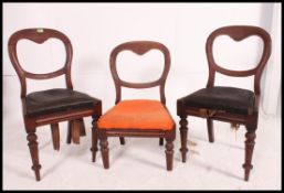 A set of 3 Victorian mahogany bar back dining chairs raised on turned legs with drop in seats and